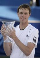 Sam Querrey holding trophy with his wet casual hairstyle.jpg
